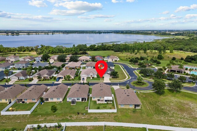 bird's eye view with a residential view and a water view