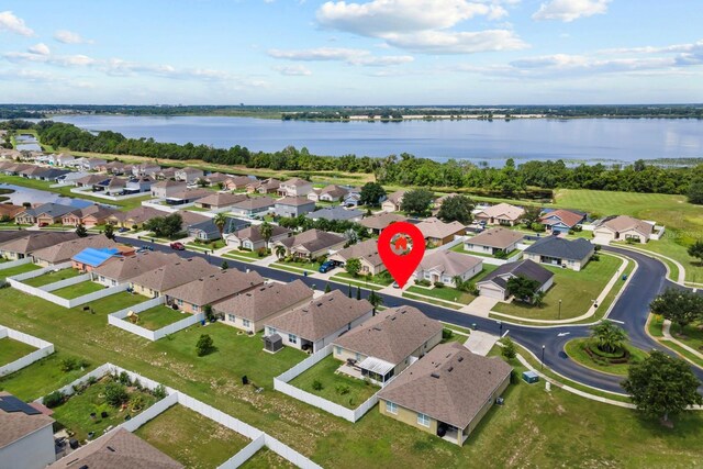 aerial view featuring a residential view and a water view
