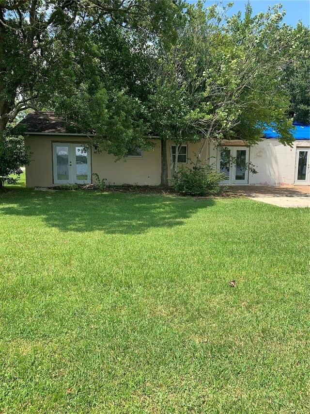 view of yard with french doors