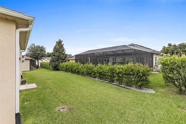 view of yard with a lanai