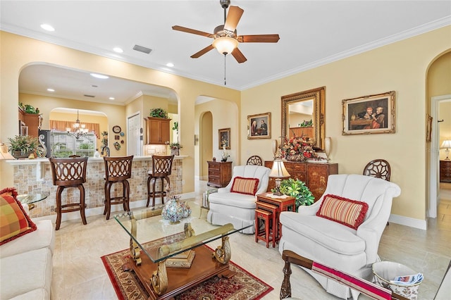 living room featuring ceiling fan with notable chandelier and crown molding