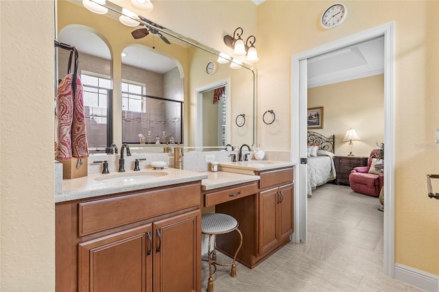 bathroom with tile patterned floors, a shower with door, and vanity