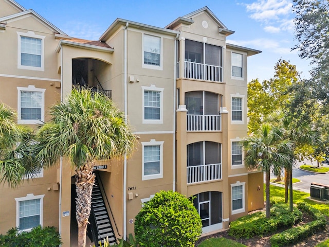 view of property featuring central AC unit