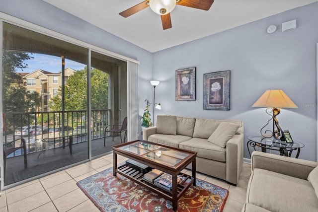 living room featuring ceiling fan and light tile patterned floors