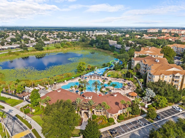 birds eye view of property with a water view