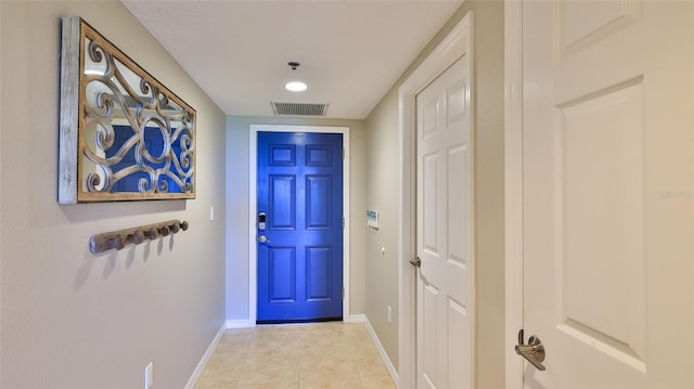 entryway featuring light tile patterned flooring