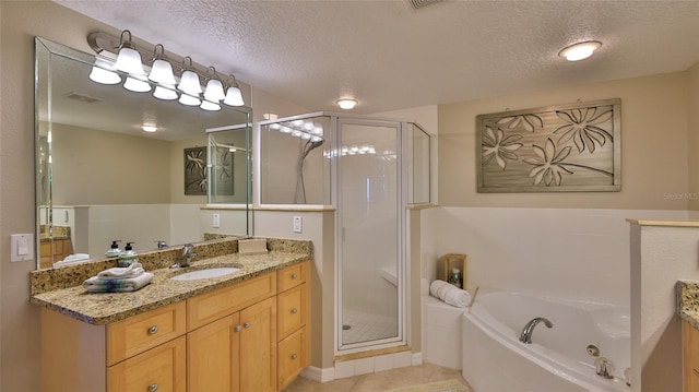 bathroom featuring plus walk in shower, a textured ceiling, and vanity