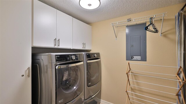 5300 S Atlantic Ave Unit 16-602, New Smyrna Beach, FL 32169 - washroom with electric panel, independent washer and dryer, a textured ceiling, cabinet space, and baseboards