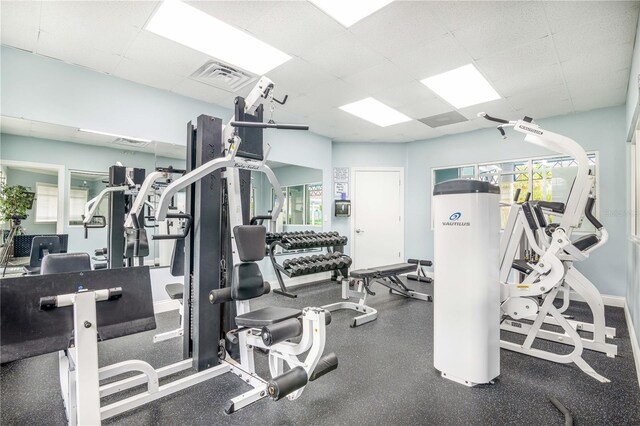 5300 S Atlantic Ave Unit 16-602, New Smyrna Beach, FL 32169 - gym featuring a paneled ceiling and baseboards