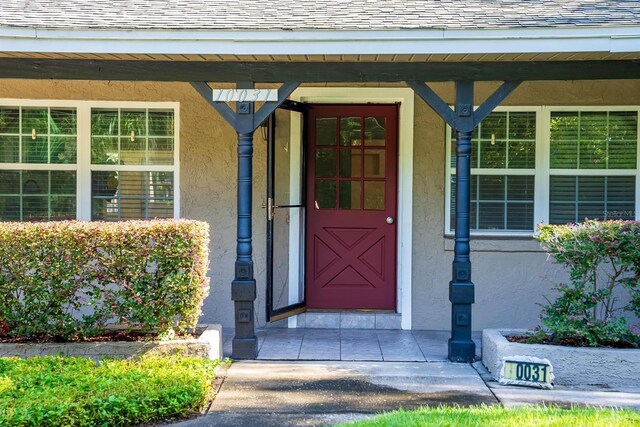 entrance to property with a porch