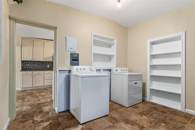 clothes washing area with built in shelves, independent washer and dryer, and dark tile patterned floors