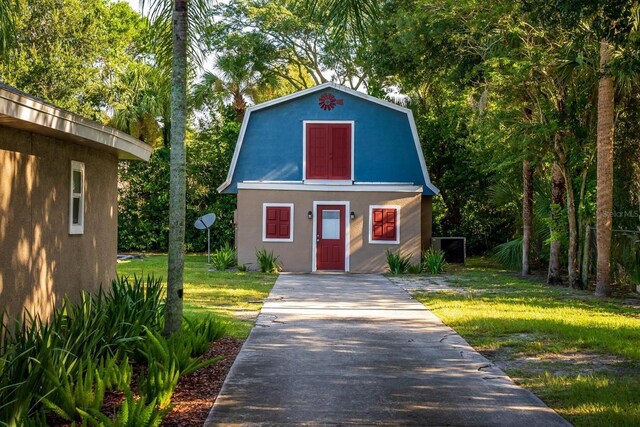 view of outbuilding with a yard