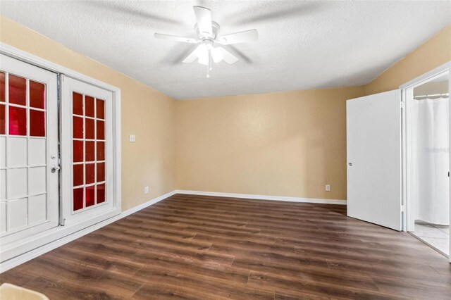 empty room featuring a textured ceiling, ceiling fan, and hardwood / wood-style flooring