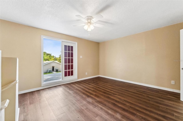 spare room featuring ceiling fan, wood-type flooring, and a textured ceiling