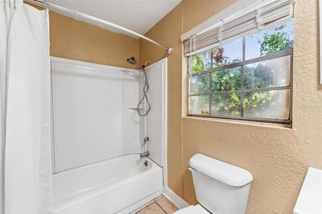 bathroom featuring shower / bath combination with curtain, toilet, and tile patterned floors