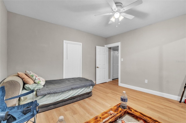 bedroom with hardwood / wood-style flooring and ceiling fan