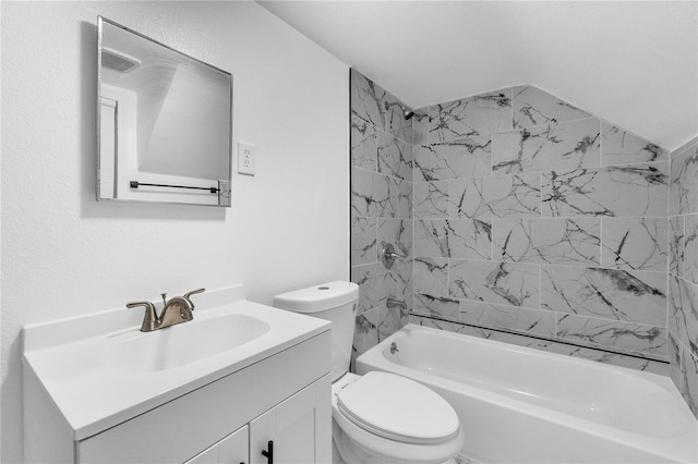 full bathroom with vanity, toilet, vaulted ceiling, and tiled shower / bath