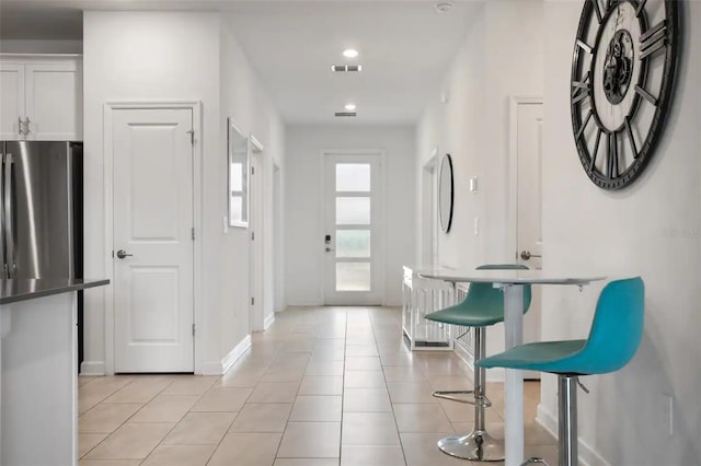 foyer with light tile patterned flooring