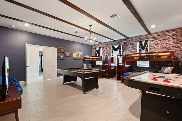 game room with beam ceiling, a chandelier, brick wall, light tile patterned floors, and billiards