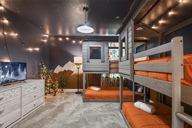 carpeted bedroom featuring a textured ceiling