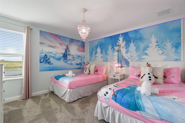 bedroom with carpet flooring and a chandelier