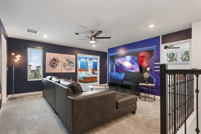 cinema featuring ceiling fan and light carpet