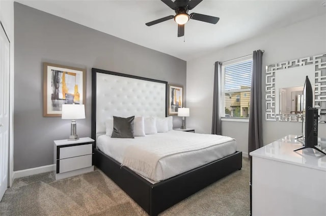 carpeted bedroom with ceiling fan