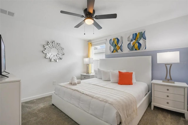 bedroom with dark colored carpet and ceiling fan