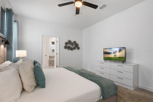 bedroom featuring light colored carpet, connected bathroom, and ceiling fan