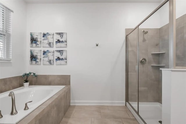 bathroom with independent shower and bath and tile patterned floors