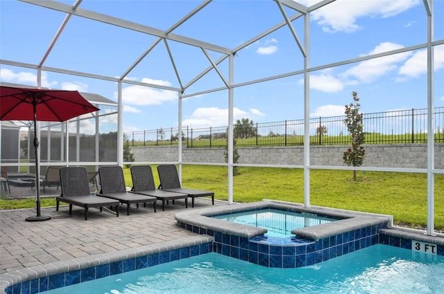 view of pool with a lawn, glass enclosure, an in ground hot tub, and a patio