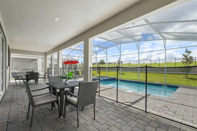 view of swimming pool with a lawn, a lanai, and a patio area