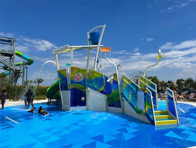 view of play area featuring a pool