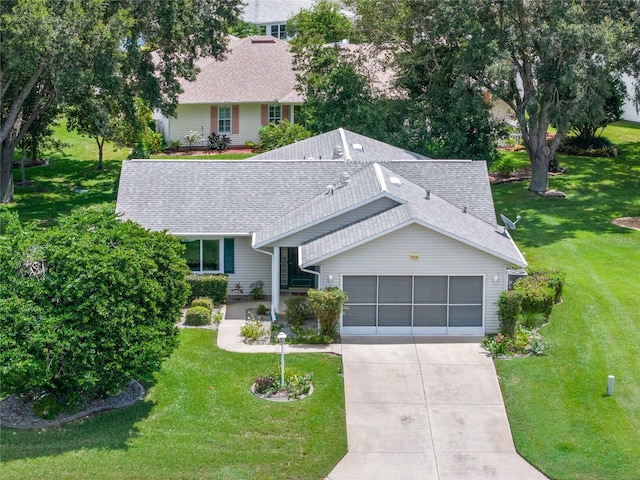 single story home with driveway, an attached garage, roof with shingles, and a front yard