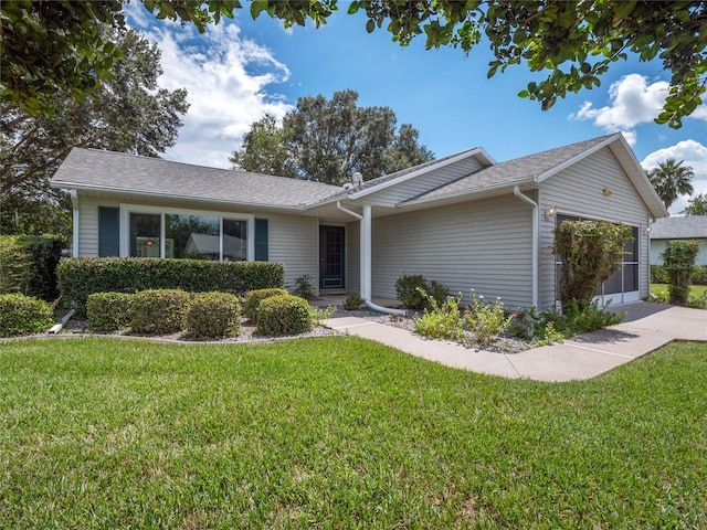 single story home featuring a front lawn