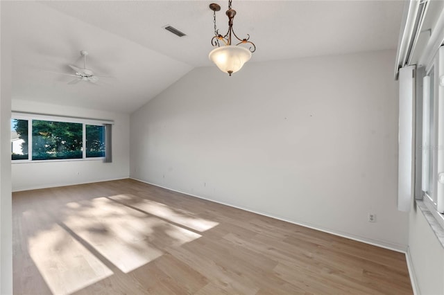 interior space featuring ceiling fan, light hardwood / wood-style floors, and lofted ceiling