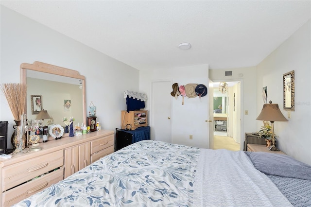 bedroom featuring light carpet