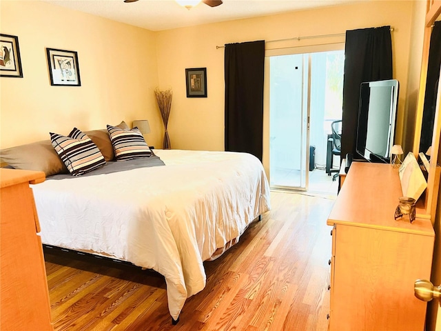 bedroom with ceiling fan, light hardwood / wood-style flooring, and access to outside