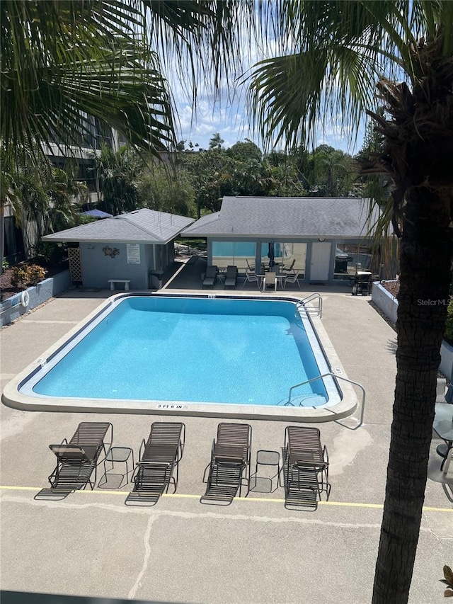 view of swimming pool featuring a patio area