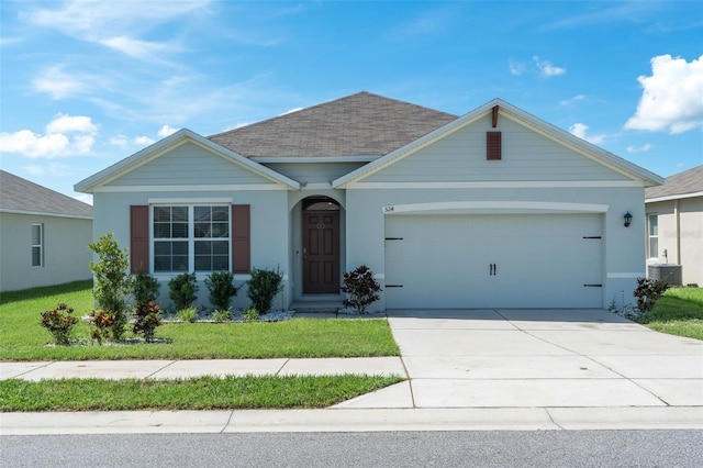 ranch-style home with a garage and a front yard