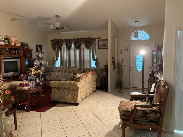 living room featuring ceiling fan and light tile patterned floors