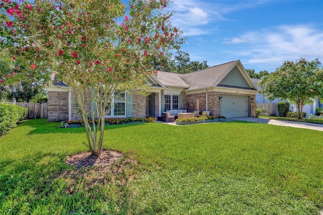 view of front of house with brick siding, an attached garage, driveway, and fence