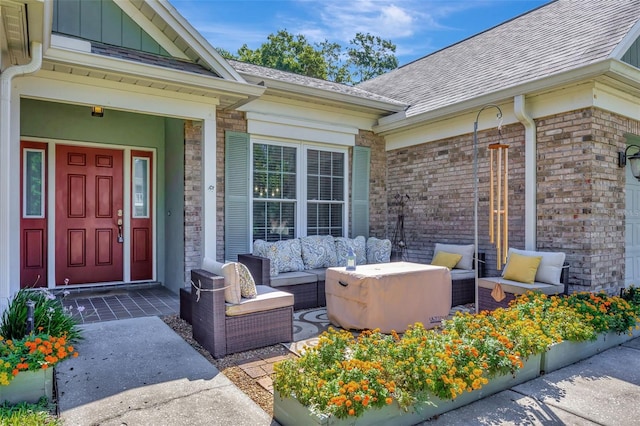 entrance to property featuring an outdoor living space and covered porch