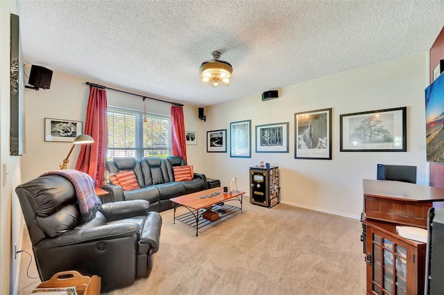 carpeted living room with baseboards and a textured ceiling