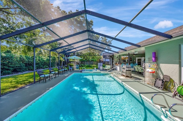 outdoor pool featuring a lanai, a patio area, and fence