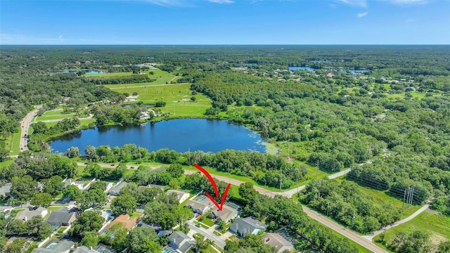 aerial view featuring a forest view and a water view