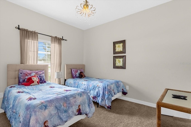 bedroom featuring carpet and a notable chandelier