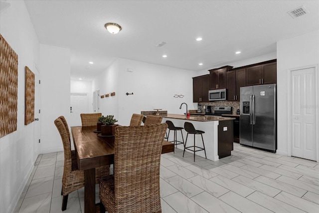 dining room with light tile patterned flooring