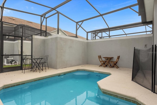 view of pool featuring a patio area and a lanai