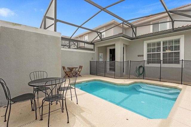 view of pool featuring a patio and a lanai